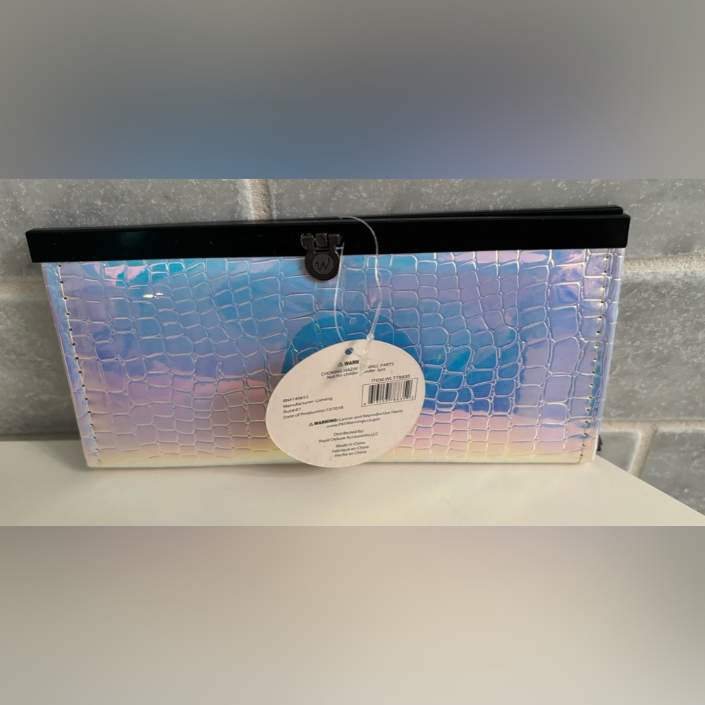 Silver metallic irradiance wallet with several slots for bills, etc.